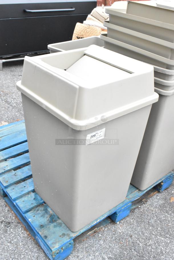 Brand new tan poly trash can with lid, minor surface scratches. Set of five on pallet. Label indicates auction lot 209.