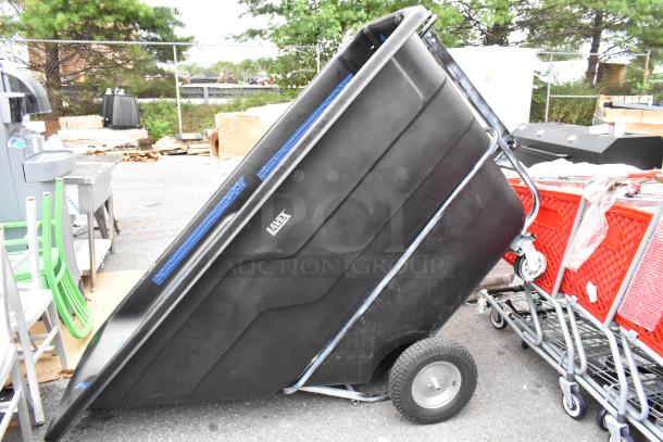 Brand new black poly tilt truck, labeled "AVEX," on wheels. Scratch and dent condition.