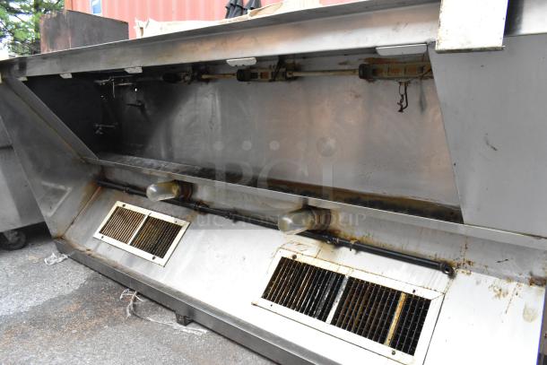 8' metal commercial grease hood, showing visible grease buildup. Features include return air vents and light fixtures.