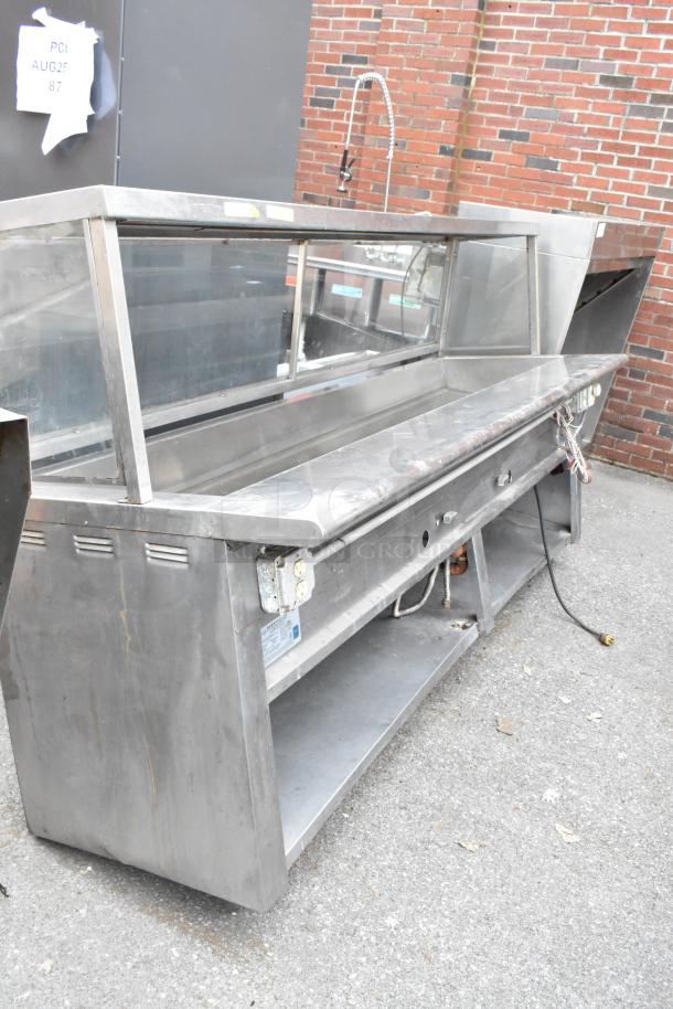 L&J CWS stainless steel steam table with sneeze guard and under shelf, in good condition. Natural gas powered.