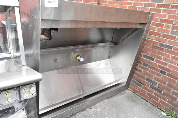 5.5' stainless steel commercial grease hood in used condition. Features visible outlets and connectors. Suitable for kitchen installation.