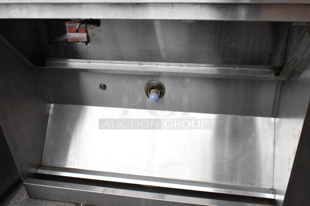 5.5' stainless steel commercial grease hood, showing inner structure and connection points, in good condition.