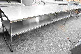 Stainless steel 2-tier overshelf, durable construction, industrial use, slight surface wear, includes labeling for identification.