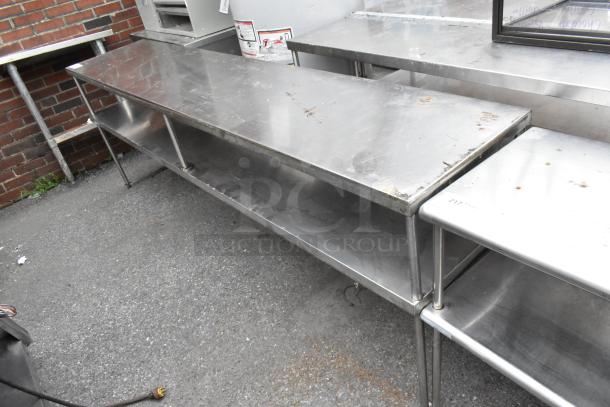 Stainless Steel 2 Tier Overshelf, durable with visible wear and rust, suitable for commercial kitchen use.
