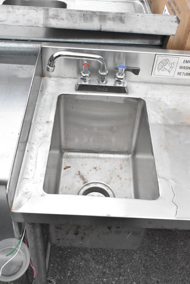 Stainless steel table with single bay sink and 2 bay sink, faucet, minor wear, ideal for commercial kitchen use.