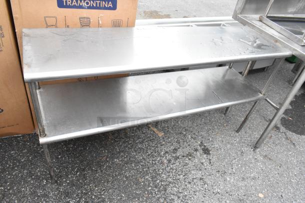 Stainless steel 2-tier overshelf in used condition, features sturdy construction with metallic finish. No visible labels or markings.