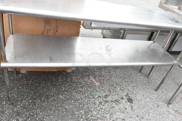 2 stainless steel 2-tier overshelves, durable construction, slightly used condition, ideal for kitchen or workspace storage.