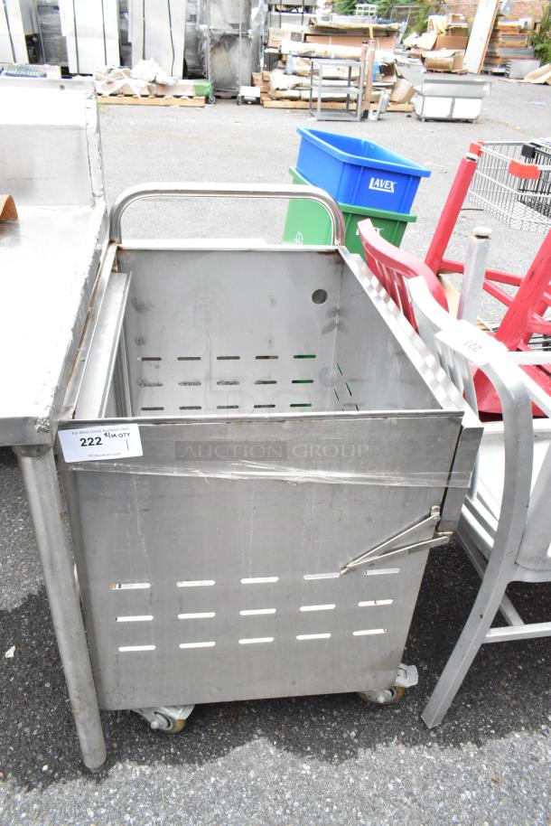 Stainless steel cart with commercial casters, perforated sides, and push handle. Some wear visible. Auction tag number: 222.
