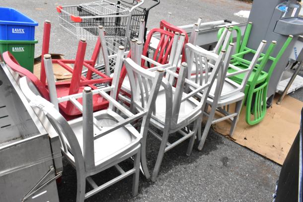 Set of 14 metal dining height chairs in green, red, and silver finish. Various conditions, stackable design.