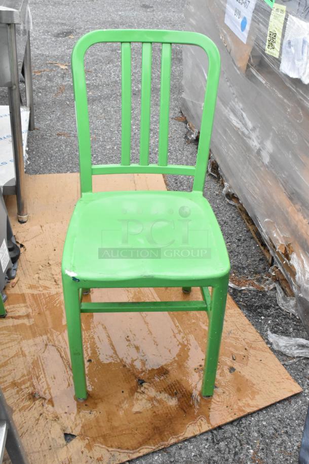 Green metal dining chair with slatted backrest, showing light wear. Auction for 14 chairs, increasing bid value.