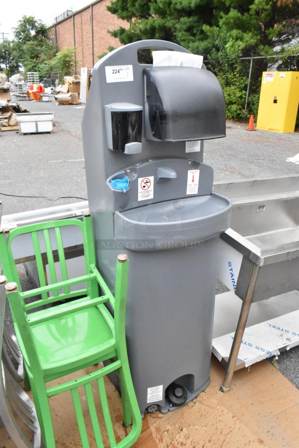 Polyjohn gray portable hand washing sink, outdoor setting, foot pump operation, soap dispenser, paper towel holder, good condition.