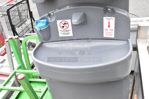 Polyjohn gray portable hand washing sink, hands-free operation, labeled for non-potable use. Good condition.