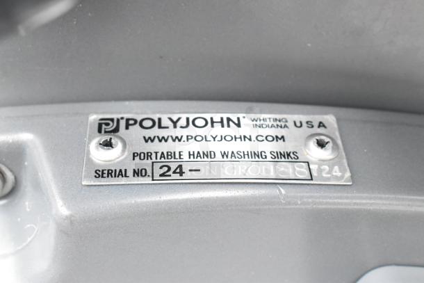 Polyjohn gray portable hand washing sink metal label, serial no. 24-197588, Whiting, Indiana USA.