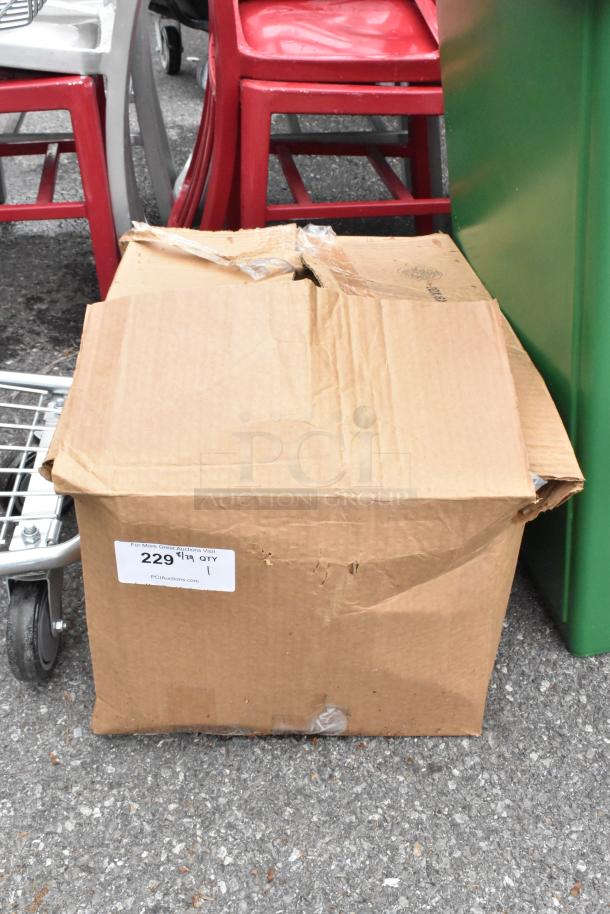 Cardboard box of ice bags, new with visible dents. Label shows item number 229, quantity 1. Box is sealed with tape.
