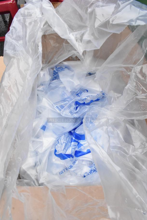 Box of new ice bags in clear plastic packaging with blue text, slight packaging damage noted.