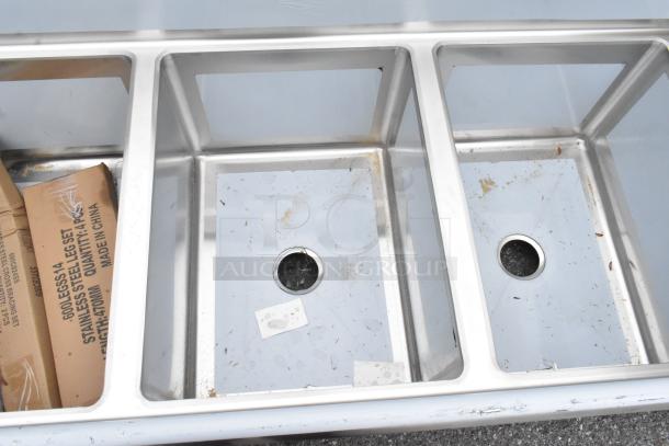 Regency 600S31824224 stainless steel 3 bay sink, scratch and dent condition, with dual drain boards; new in box markings.