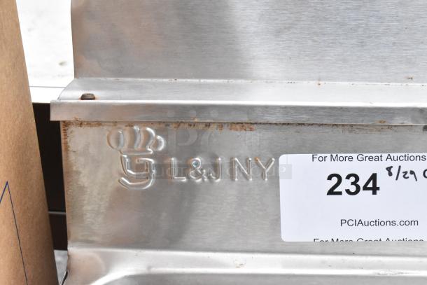 Stainless steel 3 bay bar sink with dual drain boards, faucets, and handles. Features "L&JNY" logo. Auction tag shows "234".