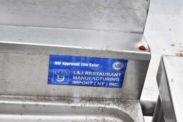 Stainless steel 3 bay bar sink with dual drain boards, faucets, and handles. Features L&J Restaurant Manufacturing label, NSF approved.