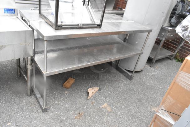 Stainless steel 2-tier overshelf, industrial-grade with solid construction, minor wear, suitable for commercial kitchens.