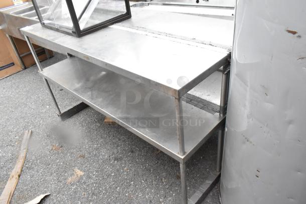 Stainless steel 2 tier overshelf, in good condition, with sturdy construction. Ideal for kitchen or storage use.