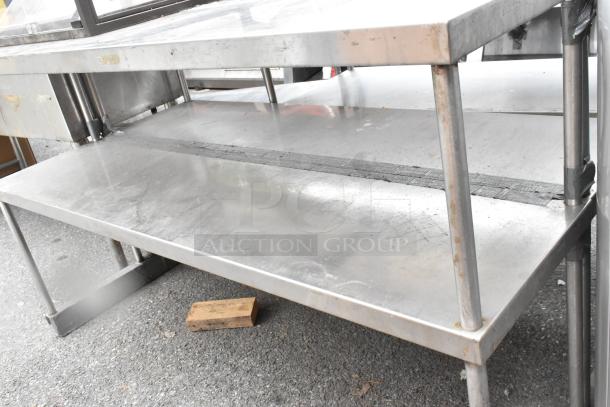 Stainless Steel 2 Tier Overshelf with sturdy columns, minor surface wear, ideal for kitchen storage and organization.