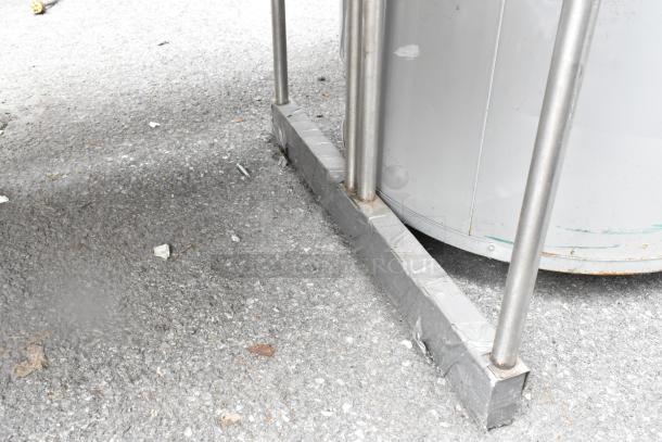 Stainless steel 2 tier overshelf with sturdy metal construction, suitable for kitchen use, shown on outdoor surface.