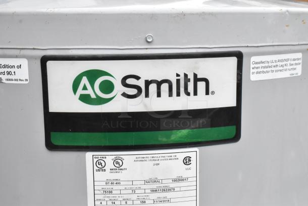 AO Smith BT-80 400 natural gas water heater, metal, 75,100 BTU. Labels indicate UL certification and model details.