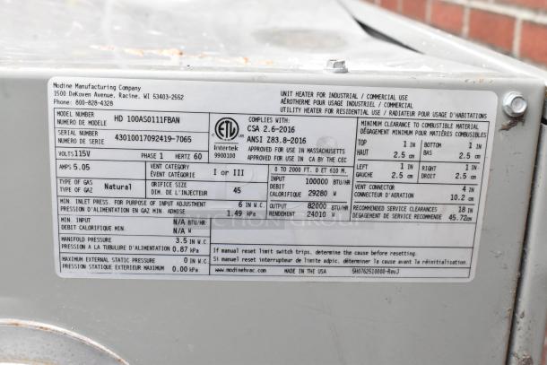Modine HD 100AS0111FBAN commercial heater, 115V, 1 phase. Label shows model, serial number, and specifications.