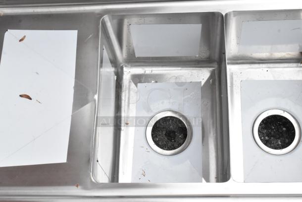 Stainless steel KoolMore SC101410-12L3 commercial 3-bay sink with left side drain board, minor scratches visible.