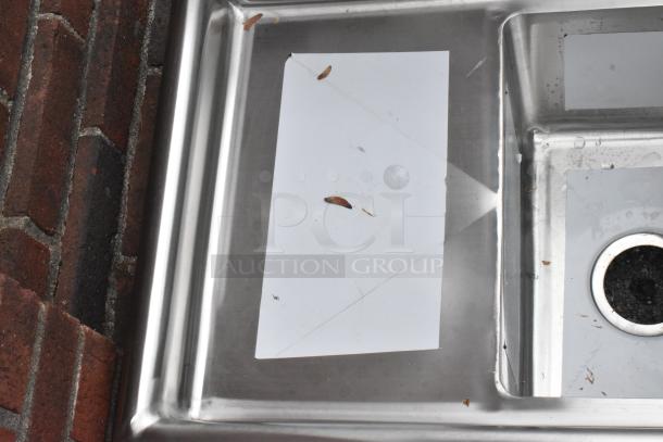 Stainless steel commercial 3 bay sink with left side drain board. Brand: KoolMore, Model: SC101410-12L3. Minor dents visible.