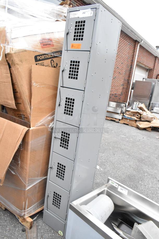 Brand new Regency 600LC16125KG gray 12"x15"x78" single 6-tier locker, with minor scratches and dents.