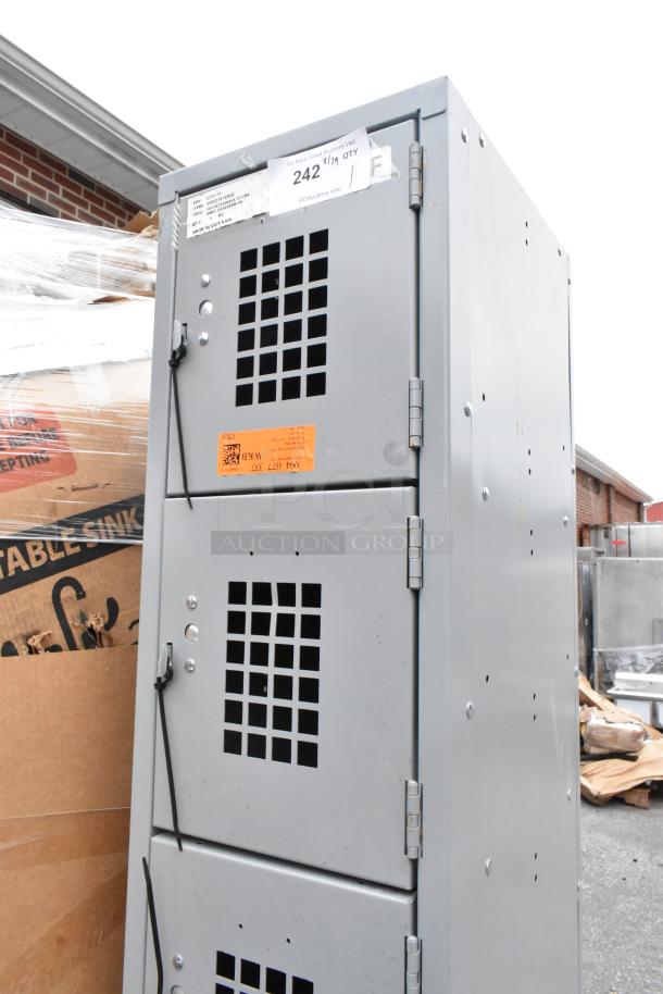 Brand new Regency 600LC16125KG gray locker, 12"x15"x78", 6 tiers, visible scratches and dents, inspection tags attached.