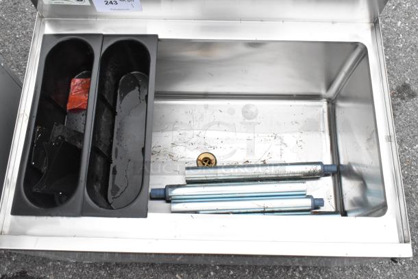 Brand new Regency 600IB2130 stainless steel underbar ice bin, 21"x30", with bottle holders, minor dents visible.