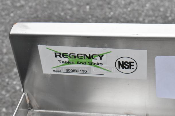 BRAND NEW with minor scratches, Regency 600IB2130 21" x 30" stainless steel underbar ice bin with bottle holders; NSF certified.