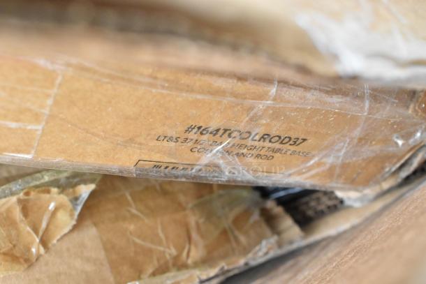 Cardboard packaging showing "#164TCOLROD37" with table base details, indicating auction item type and specification.