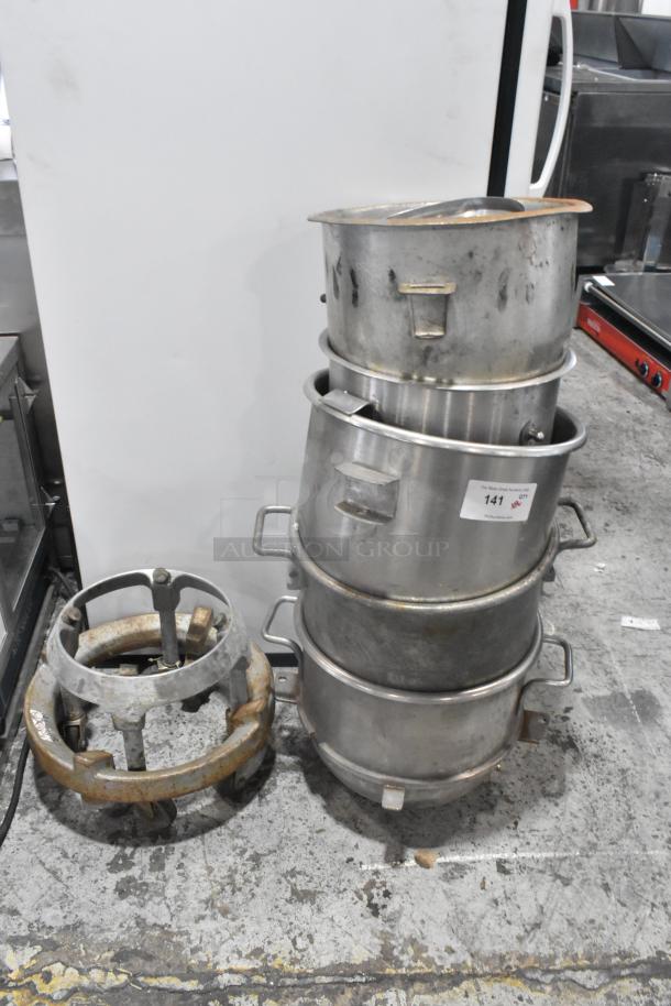 8 various items including 5 stainless steel mixing bowls and 3 mixing bowl dollies. Bowls include A200 20 Quart. Marking visible on one bowl.