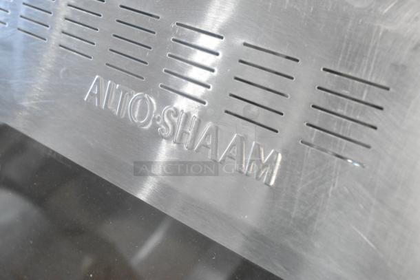 Alto Shaam stainless steel commercial heated display case with embossed brand name, 115 volts, 1 phase.