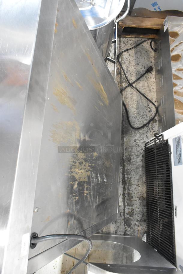 Sodir stainless steel commercial 2-door reach-in warming cabinet, 115 volts, 1 phase. Visible wear and electrical cord.