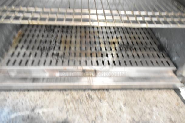 Sodir stainless steel 2-door warming cabinet. Inside, 115 volts, 1 phase. Visible wear suggests used condition.