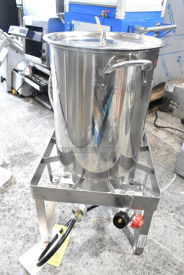 Metal propane gas powered single burner range with deep fat fryer stock pot, featuring sturdy frame and visible control knobs.