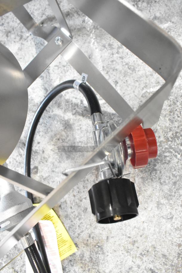 Metal propane gas burner range with deep fat fryer stock pot, features adjustable regulator, sturdy frame, and labels for safety instructions.