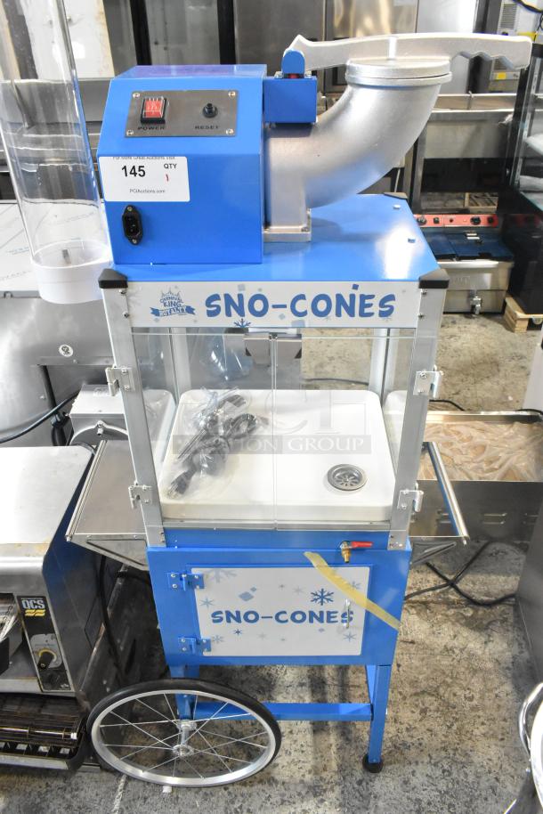 BRAND NEW Carnival King 382SCM350R Sno Cone Machine; metal, floor-style, 120V, 1 phase, minor scratches, blue, with wheels.
