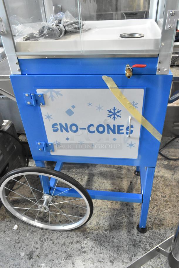 Brand new Carnival King 382SCM350R metal sno cone machine, with visible signage and wheels; scratch and dent condition.