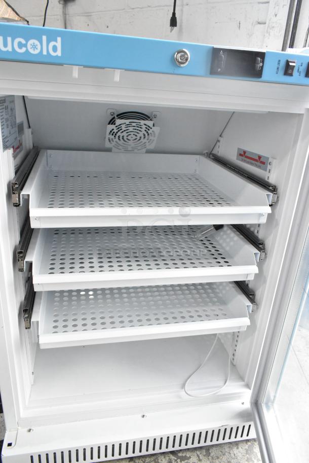 Accucold ARG6PV456 metal mini cooler merchandiser with three perforated shelves, 115 volts, 1 phase, excellent condition.