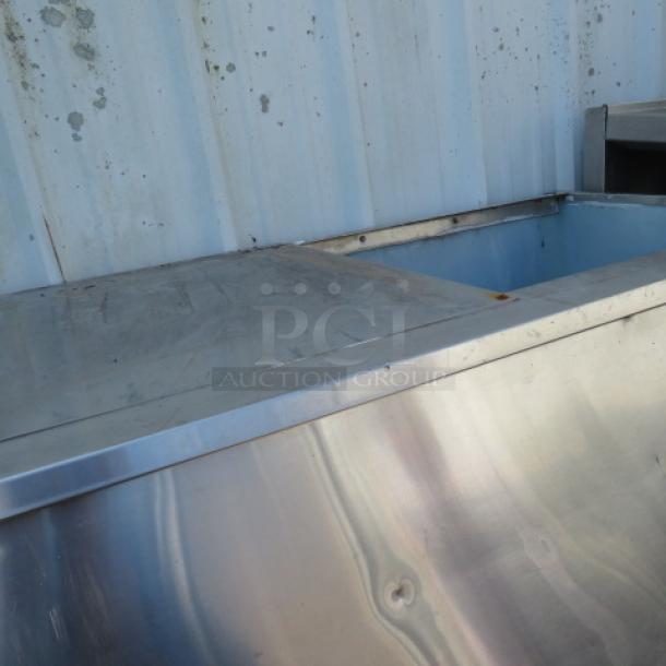 Large stainless steel ice bin, 52x32x51 inches, used condition, sturdy construction.