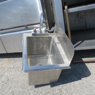 Stainless steel hand sink with faucet and right side splash shield, dimensions 13x18.5x18, in good condition.