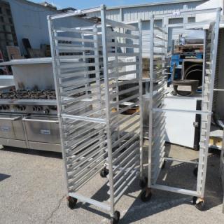 Aluminum speed rack on casters, 20.5x26x69 inches, holds multiple trays, industrial-grade, good condition.