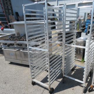 Aluminum speed rack on casters, dimensions 20.5x26x69 inches, used condition, suitable for industrial kitchens.
