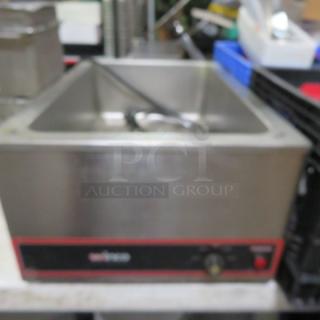 Winco FW-S500 food warmer, stainless steel, 120V, dimensions 14.5"x22.5"x9". Features temperature dial, used condition.