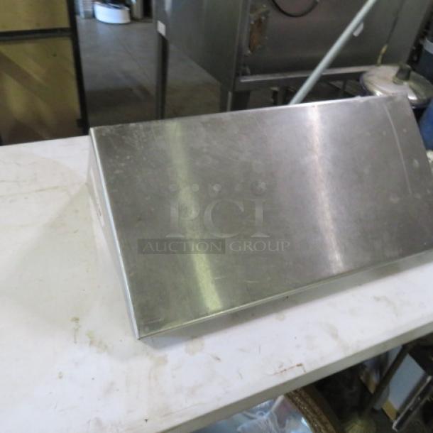 Stainless steel shelf with two brackets, 24x12x12 inches. Shows slight wear. Ideal for storage or display use.